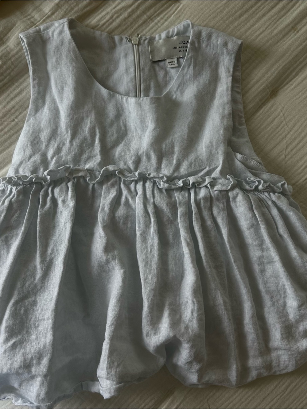 Woman’s 100 % linen white Ruffle Top
